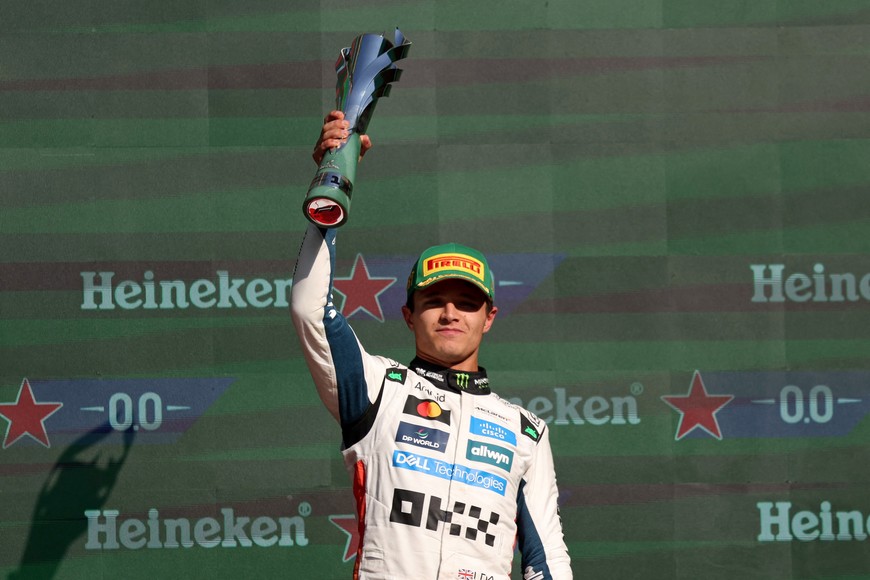 Formula One F1 - Mexico City Grand Prix - Autodromo Hermanos Rodriguez, Mexico City, Mexico - October 26, 2025
McLaren's Lando Norris celebrates with a trophy on the podium after winning the Mexico City Grand Prix REUTERS/Henry Romero