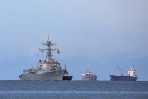 The U.S. Navy destroyer USS Gravely (DDG-107) approaches Port of Spain for joint training with the Trinidad and Tobago Defence Force to strengthen regional security and military cooperation, as seen from Port of Spain, Trinidad and Tobago, October 26, 2025. REUTERS/Andrea De Silva