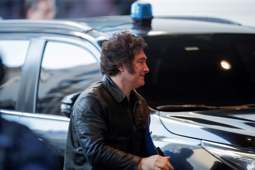 Argentina's President Javier Milei walks at campaign's headquarters on the day of the midterm election, which is seen as crucial for his administration after U.S. President Donald Trump warned that future support for Argentina would depend on Milei's party performing well in the vote, in Buenos Aires, Argentina, October 26, 2025. REUTERS/Cristina Sille