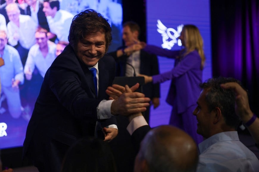 Argentina's President Javier Milei reacts as he greets people after the La Libertad Avanza party won the midterm election, which is seen as crucial for Milei's administration after U.S. President Donald Trump warned that future support for Argentina would depend on Milei's party performing well in the vote, in Buenos Aires, Argentina, October 26, 2025. REUTERS/Cristina Sille