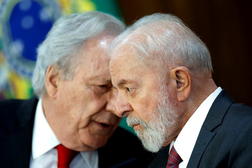 Brazil’s President Luiz Inacio Lula da Silva talks with Brazil's Justice Minister Ricardo Lewandowski during a signing ceremony to allocate resources from the Amazon Fund at the Planalto Palace in Brasilia, Brazil June 17, 2024.REUTERS/Adriano Machado
