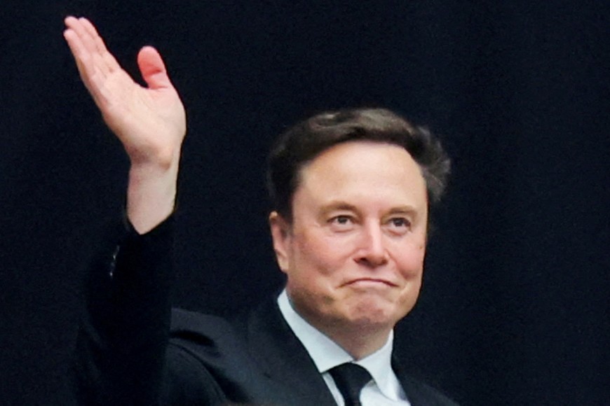 FILE PHOTO: Tesla CEO Elon Musk attends a memorial service for slain conservative commentator Charlie Kirk at State Farm Stadium, in Glendale, Arizona, U.S., September 21, 2025.  REUTERS/Daniel Cole/File Photo