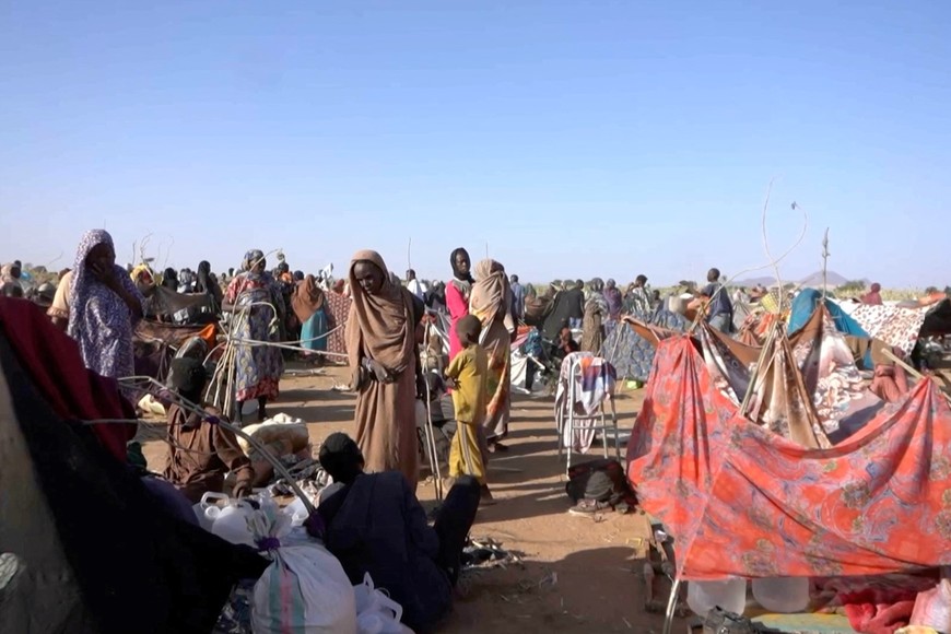 Displaced Sudanese gather and sit in makeshift tents after fleeing Al-Fashir city in Darfur, in Tawila, Sudan, October 29, 2025, in this still image taken from a Reuters' video. REUTERS/Mohamed Jamal