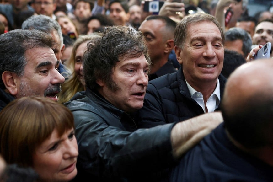 Argentina's President Javier Milei and lawmaker Diego Santilli attend a La Libertad Avanza party rally ahead of the October 26 midterm elections, seen as crucial for Milei's administration after U.S. President Donald Trump warned that future support for Argentina would depend on Milei's party performing well in the vote, in Tres de Febrero, on the outskirts of Buenos Aires, Argentina, October 17, 2025. REUTERS/Matias Baglietto