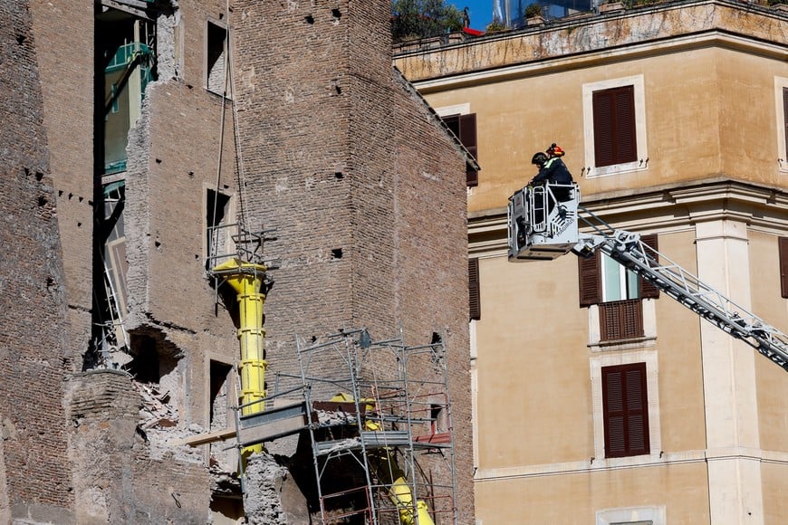 Members of emergency services work at the scene after part of the Torre dei Conti tower collapsed near Via dei Fori Imperiali, near the Colosseum, in Rome, Italy, November 3, 2025. REUTERS/Remo Casilli