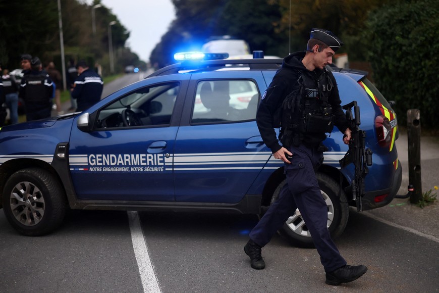 French gendarmes block off a street as they work during the search of the home of a French man who drove his car into pedestrians and cyclists in La Cotiniere near Saint-Pierre-d'Oleron on the touristic French island of Ile d'Oleron, off the Atlantic coast, France, November 5, 2025. REUTERS/Stephane Mahe