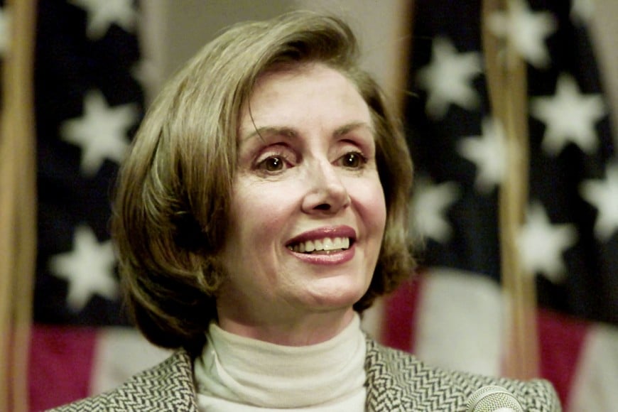 FILE PHOTO: Democratic Party Congresswoman Nancy Pelosi of San Francisco smiles as she listens to a reporter's question at a news conference in San Franciso on November 8, 2002, in which she announced that she had enough commitments from her Democratic Party congressional collegues to be elected House Minority Leader.       REUTERS/Lou Dematteis/File Photo