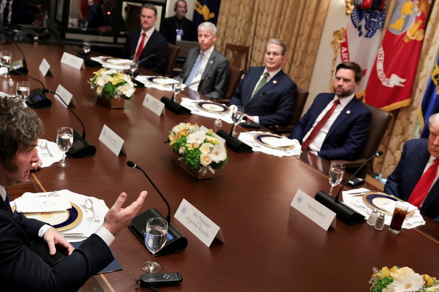 Argentina's President Javier Milei addresses U.S. President Donald Trump before their lunch in the Cabinet Room at the White House in Washington, D.C., U.S., October 14, 2025. REUTERS/Jonathan Ernst