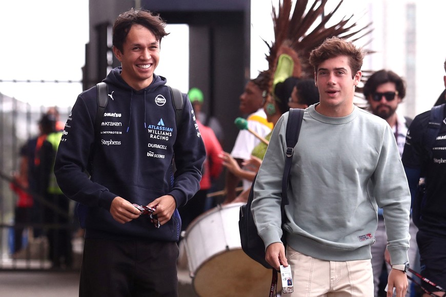 Formula One F1 - Sao Paulo Grand Prix - Autodromo Jose Carlos Pace, Sao Paulo, Brazil - November 6, 2025
Williams' Alexander Albon and Alpine's Franco Colapinto arrive ahead of the Sao Paulo Grand Prix REUTERS/Jean Carniel