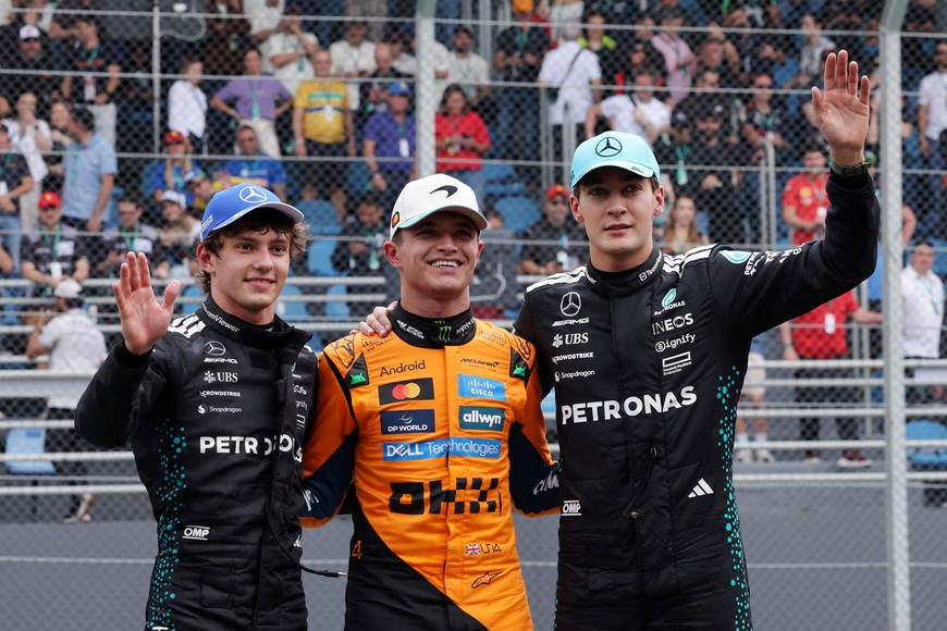 Formula One F1 - Sao Paulo Grand Prix - Autodromo Jose Carlos Pace, Sao Paulo, Brazil - November 8, 2025
McLaren's Lando Norris celebrates after winning the sprint race with second placed Mercedes' Andrea Kimi Antonelli and third placed Mercedes' George Russell REUTERS/Amanda Perobelli     TPX IMAGES OF THE DAY
