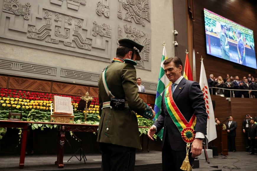 Bolivian President-elect Rodrigo Paz reacts after receiving the presidential sash from Vice President-elect Edmand Lara during his swearing-in ceremony at the Plurinational Legislative Assembly in La Paz, Bolivia, November 8, 2025. Luis Gandarillas/Pool via REUTERS