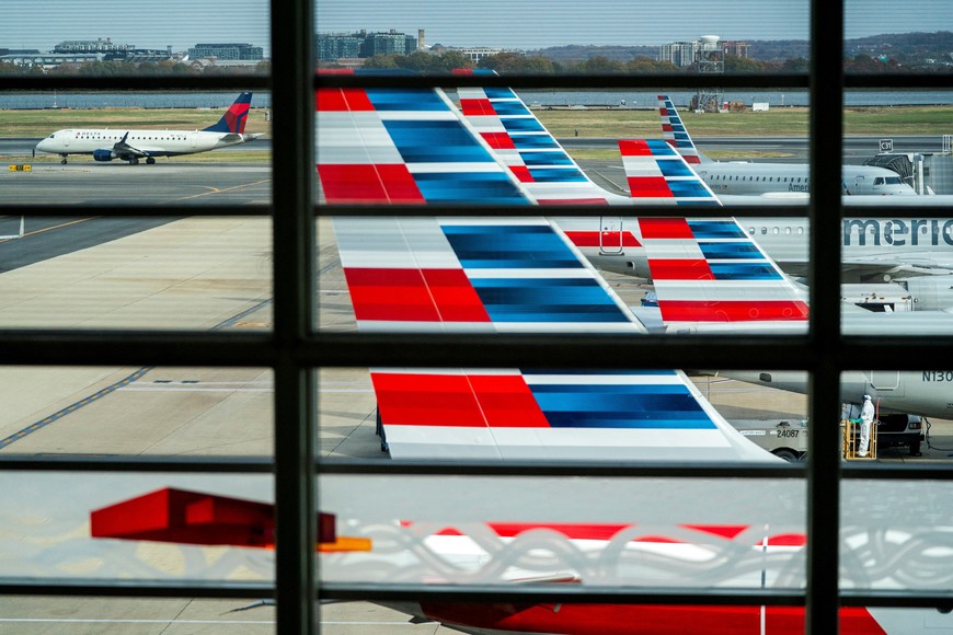 American Airlines flights stage at Ronald Reagan Washington National Airport as the Trump administration warns of impending cuts to commercial airline operations more than a month into the continuing U.S. government shutdown in Arlington, Virginia, U.S., November 7, 2025. REUTERS/Nathan Howard