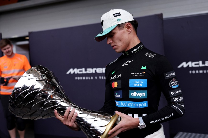 Formula One F1 - Sao Paulo Grand Prix - Autodromo Jose Carlos Pace, Sao Paulo, Brazil - November 9, 2025
McLaren's Lando Norris celebrates with a trophy after winning the Sao Paulo Grand Prix REUTERS/Amanda Perobelli