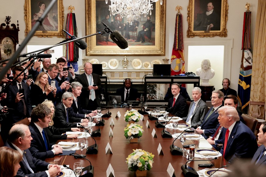 FILE PHOTO: U.S. President Donald Trump, next to U.S. Vice President JD Vance and Secretary of State Marco Rubio, sits down to lunch with Argentina's President Javier Milei in the Cabinet Room at the White House in Washington, D.C., U.S., October 14, 2025. REUTERS/Jonathan Ernst/File Photo