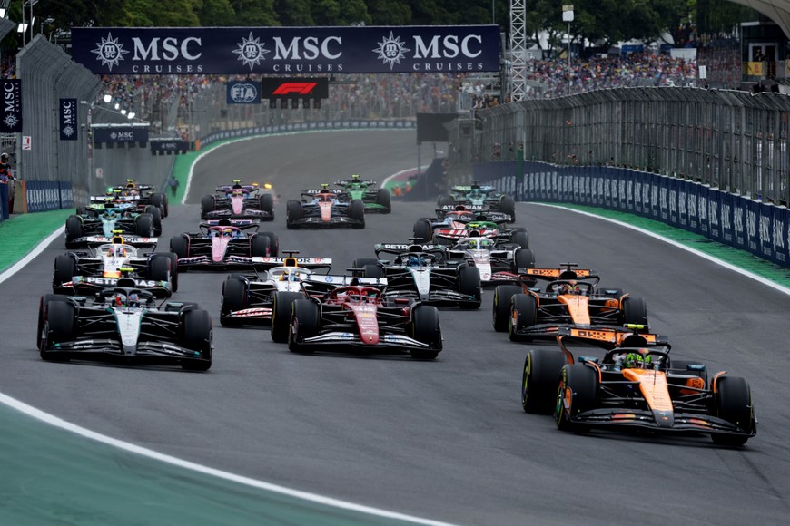 Formula One F1 - Sao Paulo Grand Prix - Autodromo Jose Carlos Pace, Sao Paulo, Brazil - November 9, 2025
McLaren's Lando Norris leads into the first corner at the start of the race REUTERS/Ricardo Moraes