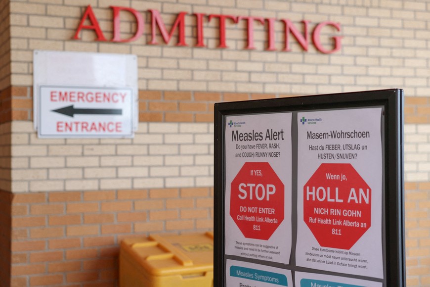 FILE PHOTO: Healthy awareness posters related to the measles outbreak during a public health awareness campaign, at the Taber Health Centre, in the largely Mennonite community of Taber, Alberta, Canada, October 27, 2025. REUTERS/Ahmed Zakot/File Photo