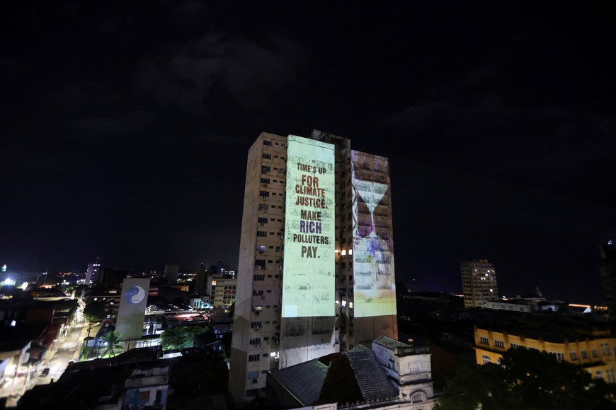 A message is projected on a building during a demonstration organized by OXFAM as the UN Climate Change Conference (COP30) is underway, in Belem, Brazil, November 10, 2025. REUTERS/Anderson Coelho