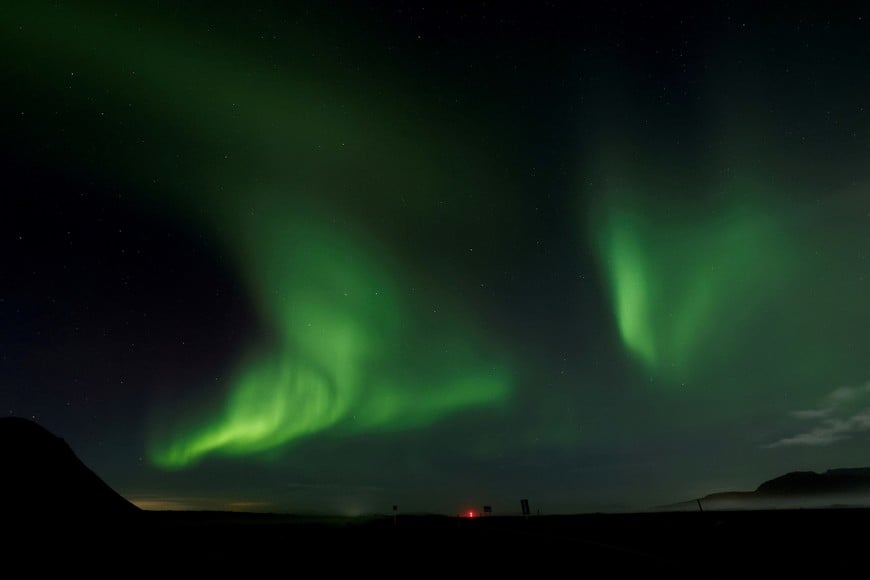 FILE PHOTO: Northern Lights, also called aurora borealis, illuminate the night sky near the town of Thorlakshofn, Iceland, October 12, 2025. REUTERS/Benoit Tessier/File Photo