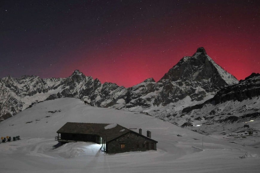 Northern Lights, also called aurora borealis, illuminate the night sky in Valtournenche, Aosta Valley, Italy, November 12, 2025, in this screengrab obtained from a social media video. Matterhorn Ski Paradise And Feratel/via REUTERS  THIS IMAGE HAS BEEN SUPPLIED BY A THIRD PARTY. MANDATORY CREDIT. NO RESALES. NO ARCHIVES.

Verification Note: Reuters was able to verify the location with the shape of the roof and the outline of the mountains that matched the file and satellite imagery of the area. The date was verified by local news and weather reports.
