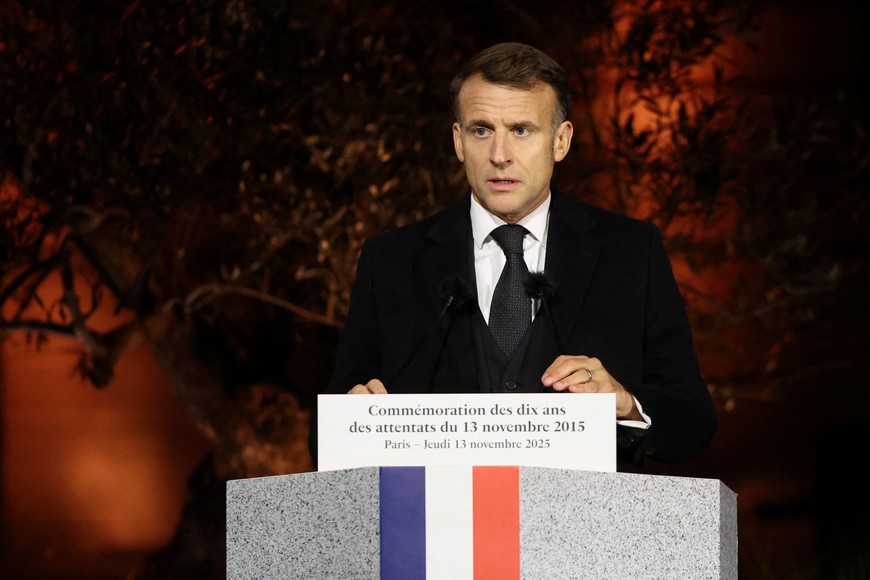 France's President Emmanuel Macron delivers a speech during a ceremony marking a decade since the attacks of November 13, 2015 in which 130 civilians were killed, at the "Jardin du 13 novembre 2015" in Paris on November 13, 2025.     LUDOVIC MARIN/Pool via REUTERS