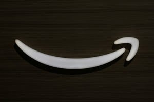 FILE PHOTO: The arrow from Amazon's logo is displayed during an Amazon Devices launch event in New York City, U.S., February 26, 2025. REUTERS/Brendan McDermid/File Photo