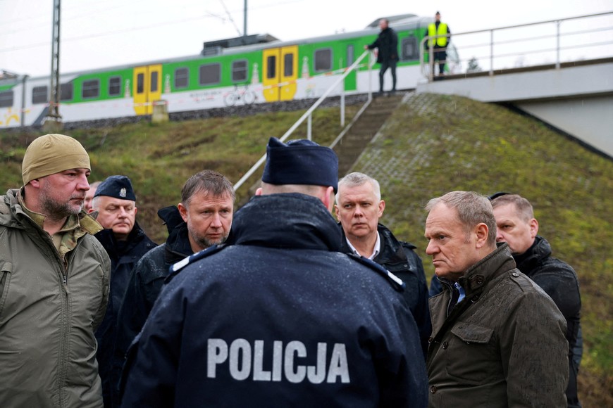 Polish Prime Minister Donald Tusk visits the site of a blast on railway of the Warsaw-Lublin line in Mika, Poland, November 17, 2025. KPRM/Handout via REUTERS ATTENTION EDITORS - THIS IMAGE HAS BEEN SUPPLIED BY A THIRD PARTY. NO RESALES. NO ARCHIVES