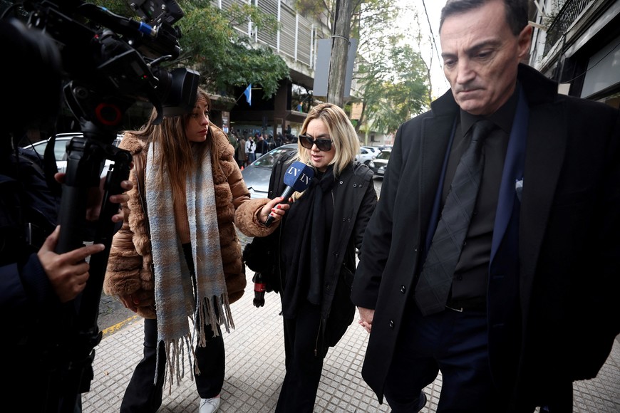 Veronica Ojeda, ex-girlfriend of late Argentine soccer legend Diego Maradona, and her lawyer Mario Baudry leave the San Isidro court after a hearing to determine the future of soccer legend Diego Maradona's trial, after one of the three presiding judges stood down from the case amid accusations of ethical breaches, in San Isidro, on the outskirts of Buenos Aires, Argentina, May 29, 2025. REUTERS/Agustin Marcarian