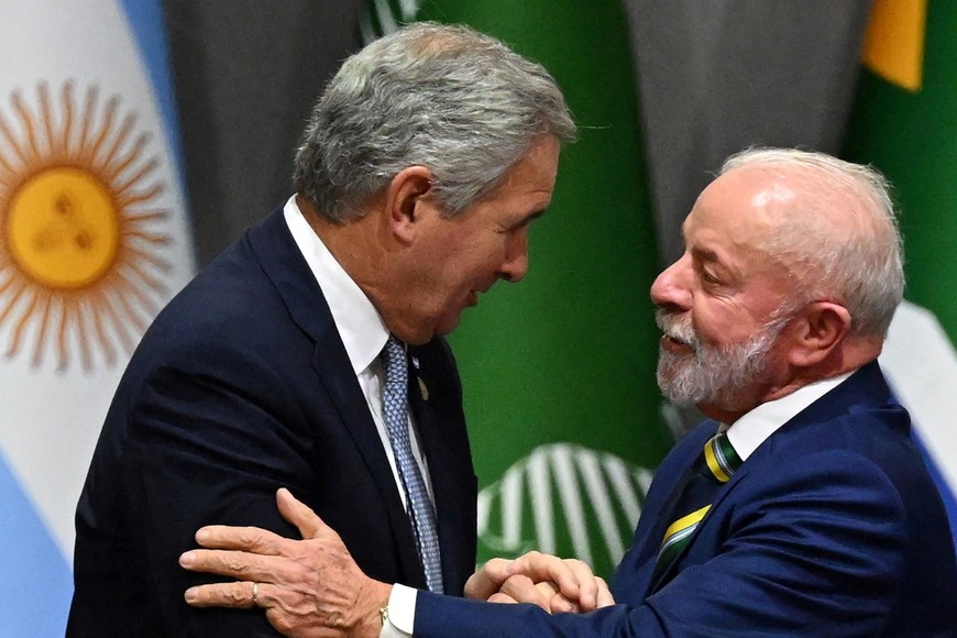 El saludo de Quirno con Lula. Reuters