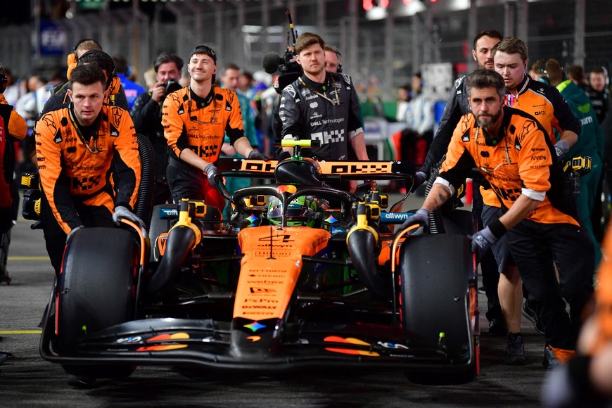 Nov 21, 2025; Las Vegas, NV, USA; The car of McLaren driver Lando Norris (4) is wheeled to his grid spot before the Las Vegas Grand Prix at Las Vegas Strip Circuit. Mandatory Credit: Gary A. Vasquez-Imagn Images