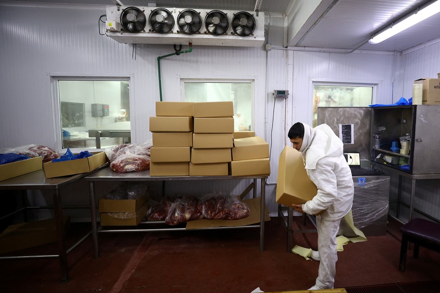 An employee handles packed beef for export at a meat processing plant in Moron, Buenos Aires, Argentina, May 16, 2025. REUTERS/Agustin Marcarian