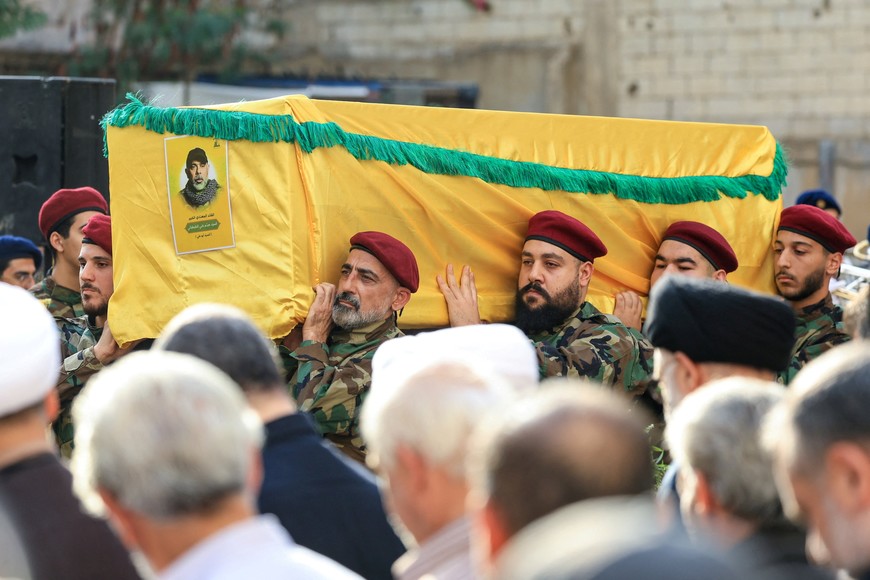 Pallbearers carry the coffin of Hezbollah's top military official, Haytham Ali Tabtabai, who was killed by an Israeli airstrike on Sunday, despite a U.S.-brokered truce a year ago, during his funeral in Beirut's southern suburbs, Lebanon November 24, 2025. REUTERS/Mohamed Azakir