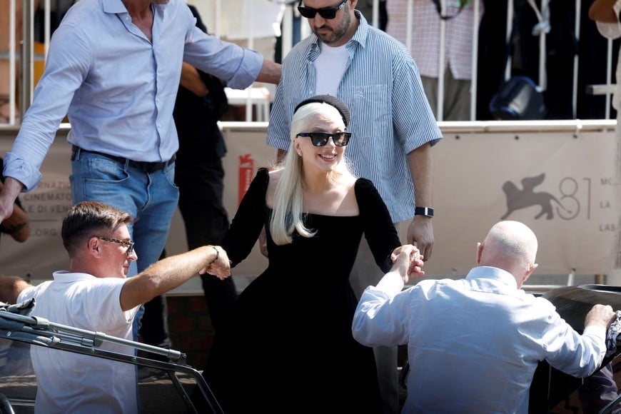 Lady Gaga is helped during the 81st Venice Film Festival ahead of the world premiere of "Joker: Folie a Deux", in Venice, Italy September 4, 2024. REUTERS/Louisa Gouliamaki     TPX IMAGES OF THE DAY
