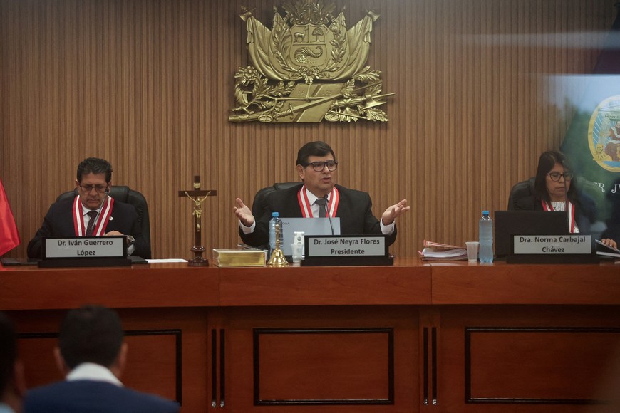 FILE PHOTO: Members of criminal chamber of Peru's Supreme Court attend the beginning of oral trial of Peru's former President Pedro Castillo charged with rebellion and other offenses against the state, in Lima, Peru March 4, 2025. Picture taken through a glass. REUTERS/Sebastian Castaneda/File Photo