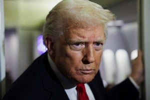 U.S. President Donald Trump looks on aboard Air Force One during travel to Palm Beach, Florida, from Joint Base Andrews, Maryland, U.S., November 25, 2025. REUTERS/Anna Rose Layden