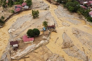 A drone view shows an area hit by deadly flash floods following heavy rains in Padang, West Sumatra province, Indonesia, November 30, 2025. REUTERS/Aidil Ichlas