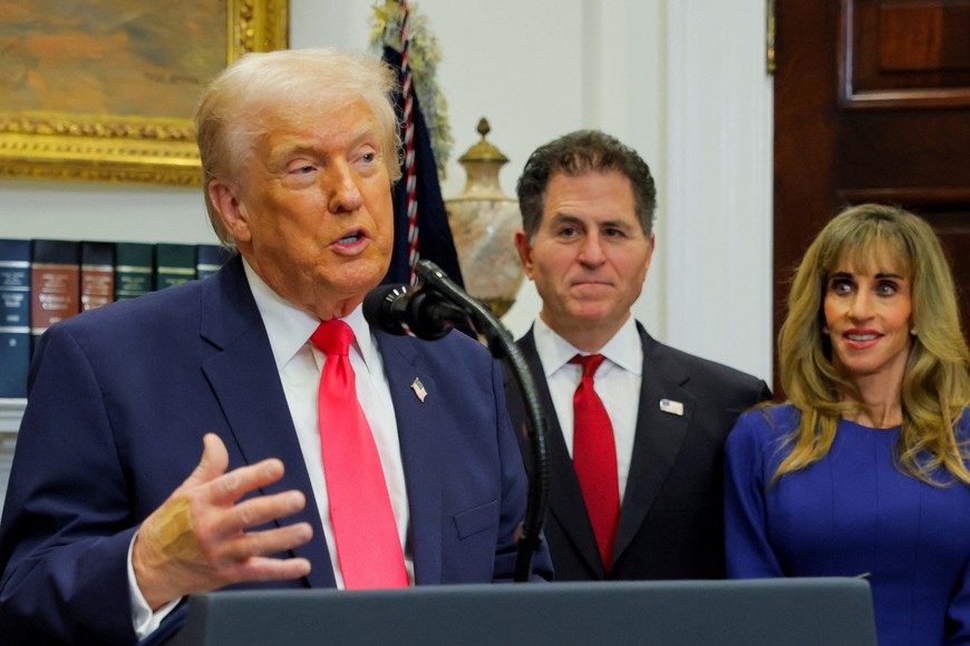 U.S. President Donald Trump makes an announcement about "Trump accounts", accompanied by CEO of Dell Technologies Michael Dell and his wife Susan Dell, in the Roosevelt Room at the White House in Washington, D.C., U.S., December 2, 2025. REUTERS/Brian Snyder