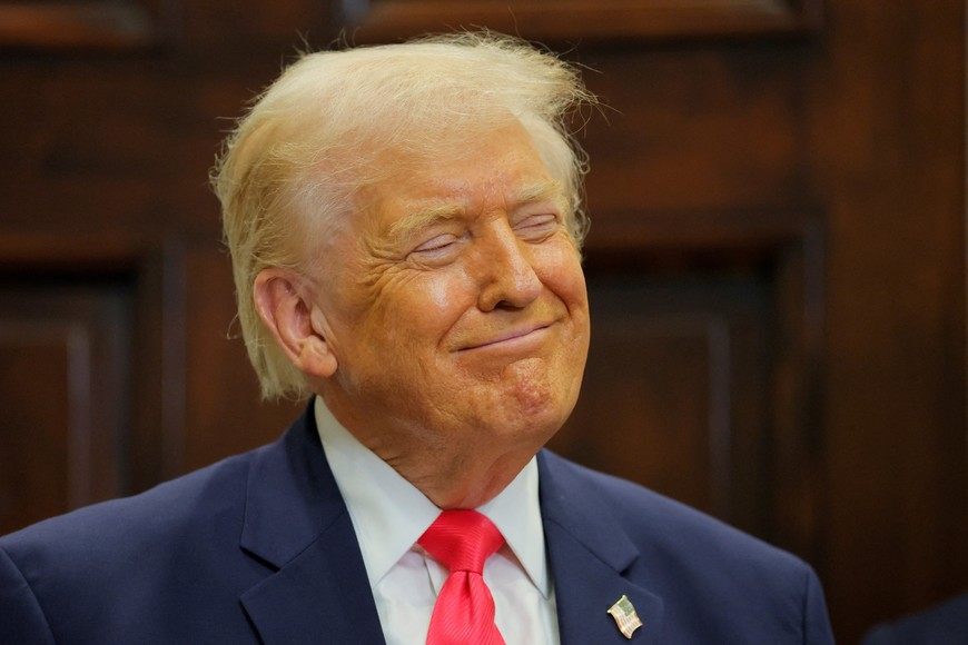 U.S. President Donald Trump smiles during an announcement about "Trump accounts", in the Roosevelt Room at the White House in Washington, D.C., U.S., December 2, 2025. REUTERS/Brian Snyder