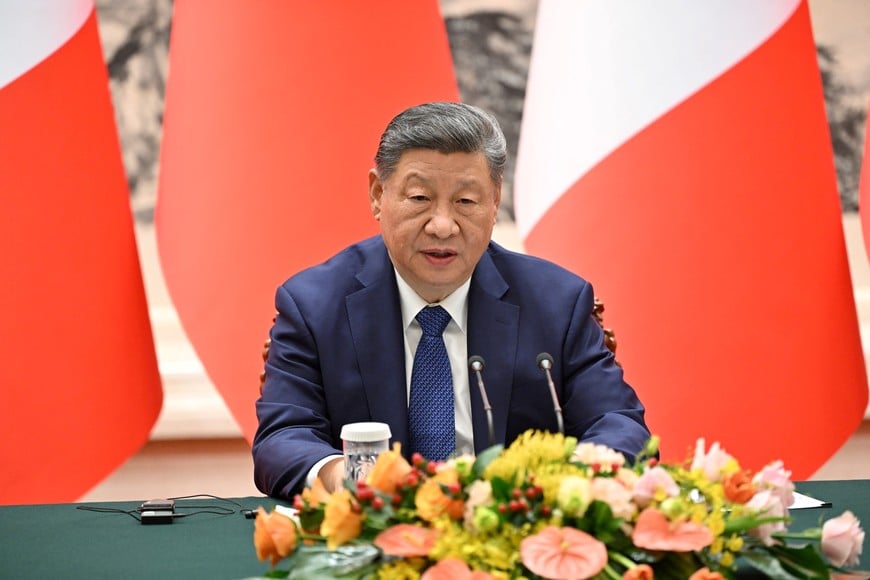 China’s President Xi Jinping speaks next to France’s President Emmanuel Macron (not pictured) during a joint press conference at the Great Hall of the People in Beijing on December 4, 2025. ADEK BERRY/Pool via REUTERS
