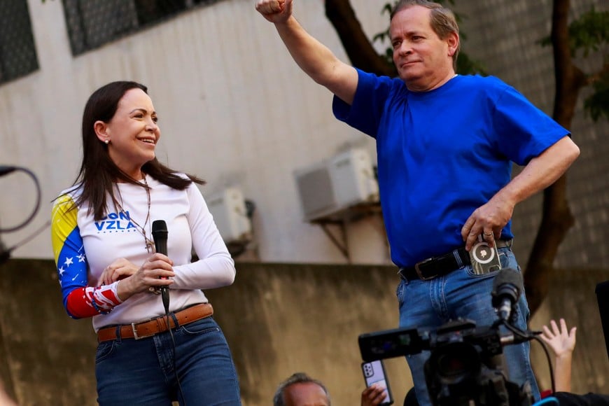 Venezuela opposition leaders Juan Pablo Guanipa and Maria Corina Machado attend a rally, in Caracas, Venezuela, January 9, 2025. Juan Pablo Guanipa is under arrest for allegedly leading a terrorist plot, which the Interior Minister Diosdado Cabello said on Friday, May 23, 2025. REUTERS/Leonardo Fernandez Viloria
