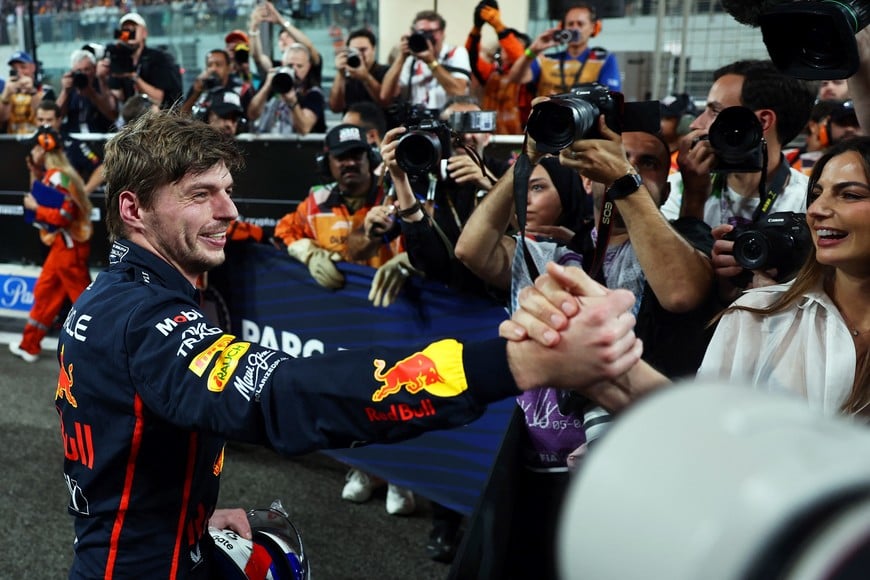 Formula One F1 - Abu Dhabi Grand Prix - Yas Marina Circuit, Abu Dhabi, United Arab Emirates - December 6, 2025
Red Bull's Max Verstappen celebrates with his partner Kelly Piquet after qualifying in pole position REUTERS/Jakub Porzycki