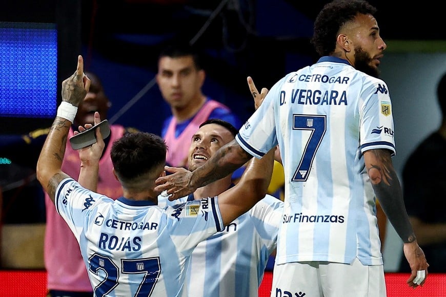 Soccer - Argentina - Argentine Primera Division - Torneo Clausura - Boca Juniors v Racing Club - Estadio La Bombonera, Buenos Aires, Argentina - December 7, 2025
Racing Club's Adrian Martinez celebrates scoring their first goal with Gabriel Rojas and Duvan Vergara REUTERS/Agustin Marcarian
