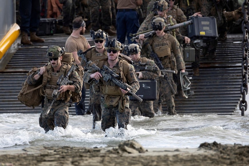 U.S. Marines disembark from a U.S. Navy Landing Craft Utility (LCU) during amphibious operations in Arroyo, Puerto Rico, December 9, 2025. REUTERS/Ricardo Arduengo