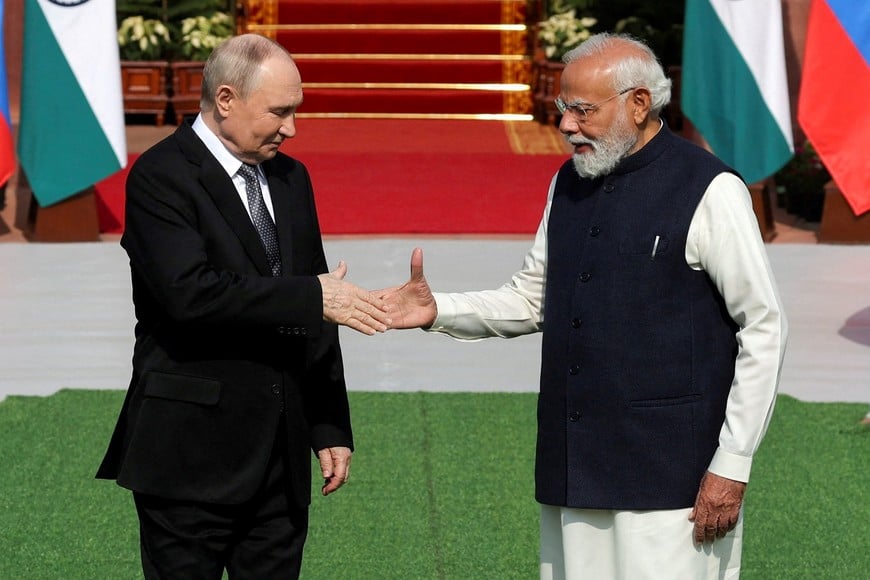 Russia's President Vladimir Putin shakes hands with India's Prime Minister Narendra Modi ahead of their meeting at Hyderabad House in New Delhi, India, December 5, 2025. REUTERS/Adnan Abidi     TPX IMAGES OF THE DAY
