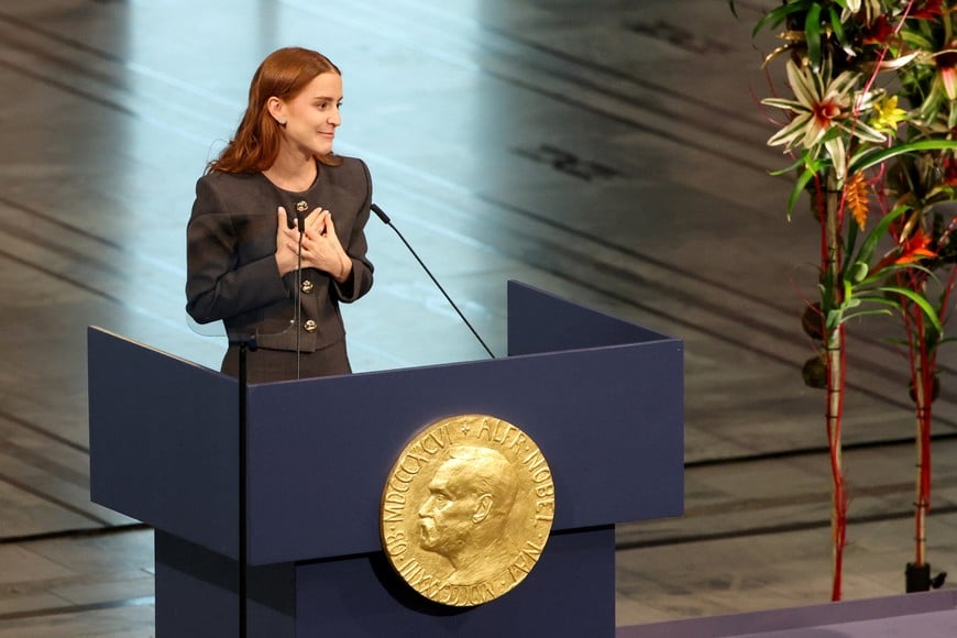 Ana Corina Sosa Machado, daughter of Venezuelan opposition leader Maria Corina Machado, delivers a speech as she receives the Nobel Peace Prize on behalf of her mother, in Oslo, Norway December 10, 2025. REUTERS/Leonhard Foeger