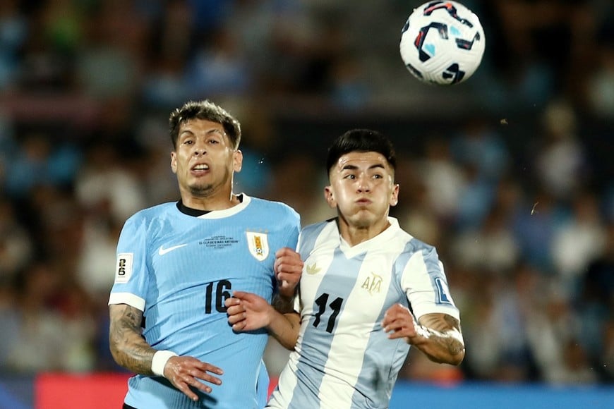 Soccer Football - World Cup - South American Qualifiers - Uruguay v Argentina - Estadio Centenario, Montevideo, Uruguay - March 21, 2025
Uruguay's Mathias Olivera in action with Argentina's Thiago Almada REUTERS/Andres Cuenca