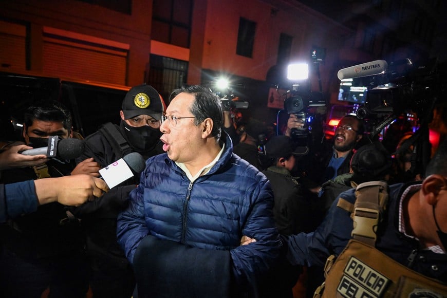 Former Bolivian President Luis Arce Catacora speaks to the media as he enters San Pedro prison after a judge ordered him held in pre-trial detention for five months as part of an investigation into alleged embezzlement, in La Paz, Bolivia, December 12, 2025. REUTERS/Claudia Morales