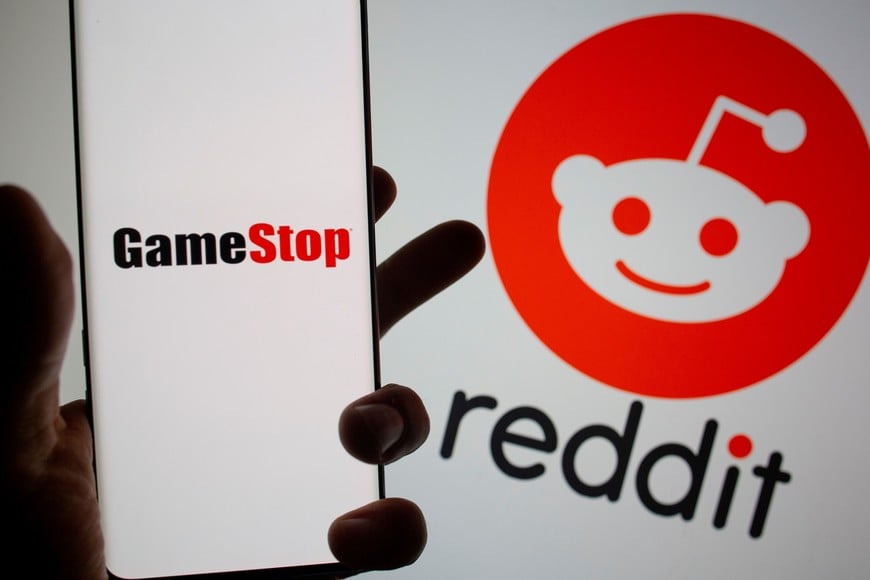 FILE PHOTO: GameStop logo is seen in front of displayed Reddit logo in this illustration taken on Febr. 2, 2021. REUTERS/Dado Ruvic/Illustration/File Photo/File Photo