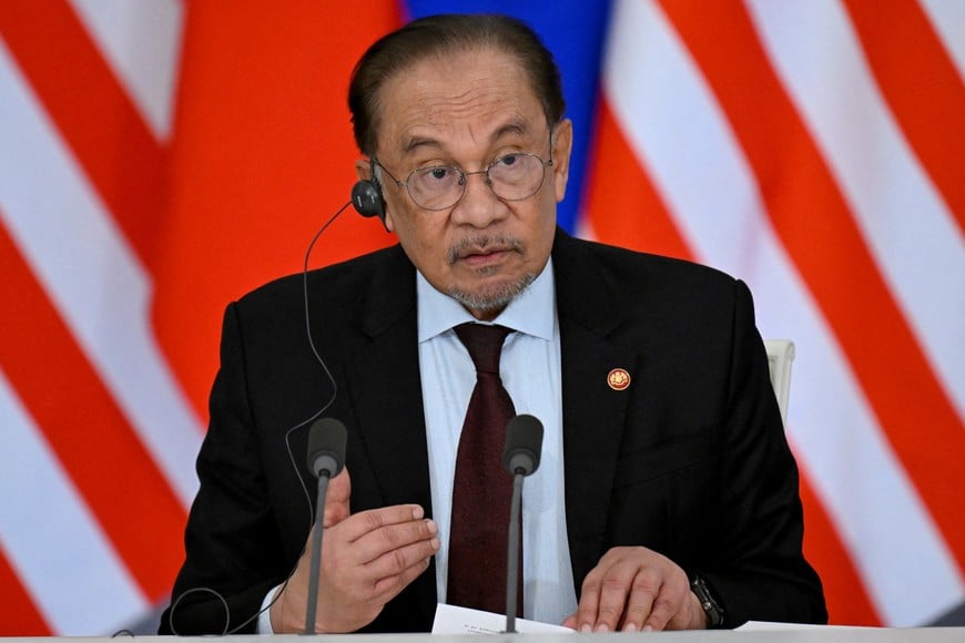 FILE PHOTO: Malaysian Prime Minister Anwar Ibrahim speaks during a joint media statement with Russian President Vladimir Putin following their talks at the Kremlin in Moscow, Russia May 14, 2025. Alexander Nemenov/Pool via REUTERS/File Photo