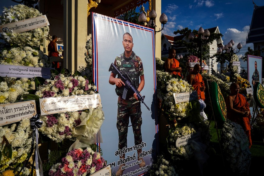 Buddhist monks attend a royal cremation of Private Therdsak Srilachai, 20, who was killed during clashes between Thailand and Cambodia along a disputed border area, at a temple in Si Sa Ket province, Thailand, December 13, 2025. REUTERS/Athit Perawongmetha