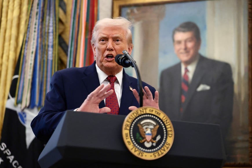 U.S. President Donald Trump speaks during a Mexican Border Defense Medal presentation in the Oval Office at the White House in Washington, D.C., U.S., December 15, 2025. REUTERS/Evelyn Hockstein